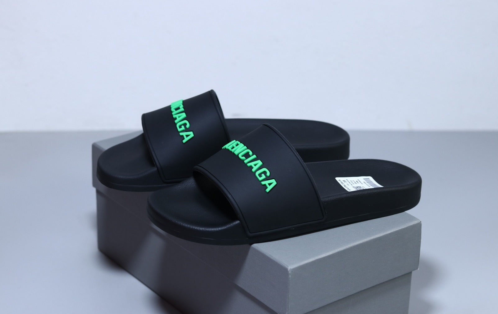 Black and cheap green balenciaga slides